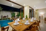Villa-Sophia-Legian-Bali-Dining-table-overlooking-the-pool
